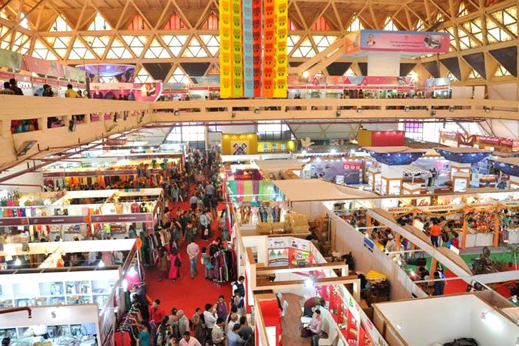 Exhibition hall with booths and visitors